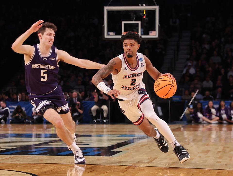 March 22, 2024, Brooklyn, NY, USA; Florida Atlantic Owls guard Nicholas Boyd (2) drives past Northwestern Wildcats guard Ryan Langborg (5) in the first round of the 2024 NCAA Tournament at the Barclays Center. Mandatory Credit: Brad Penner-USA TODAY Sports