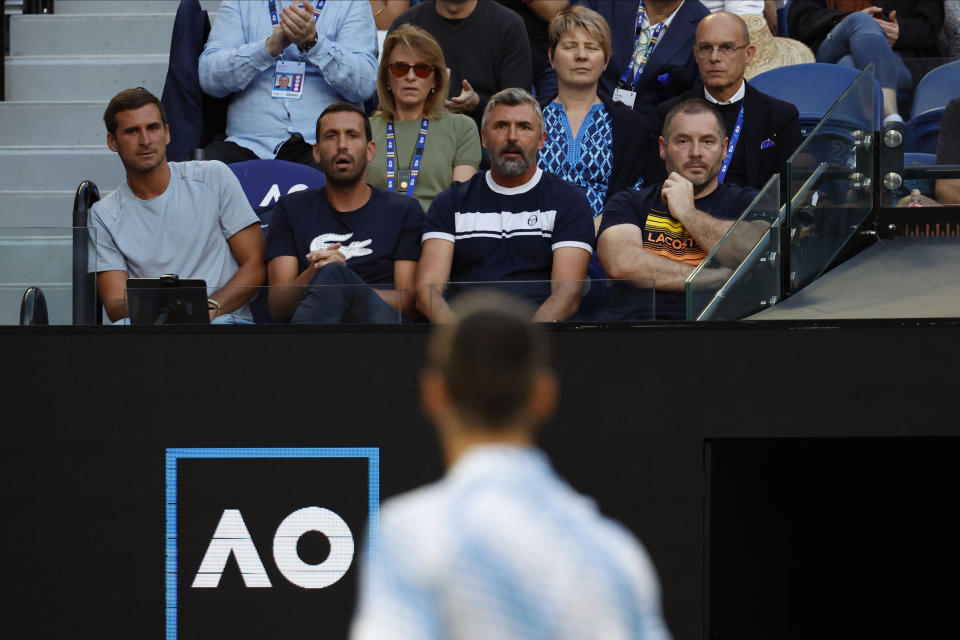 Novak Djokovic of Serbia looks to his players box during his semifinal against Tommy Paul of the U.S. at the Australian Open tennis championship in Melbourne, Australia, Friday, Jan. 27, 2023. (AP Photo/Asanka Brendon Ratnayake)