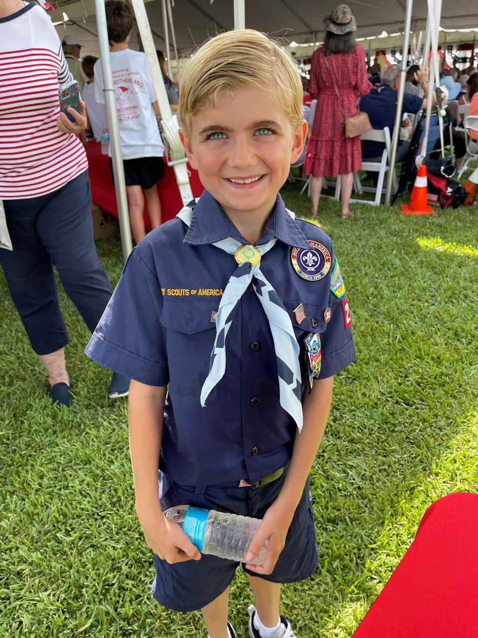 Thomas Gorman, 8, of Boy Scout Troop 226, helped distribute water at the annual Earl Hodges Memorial Day Picnic in Collier County, May 29, 2023.