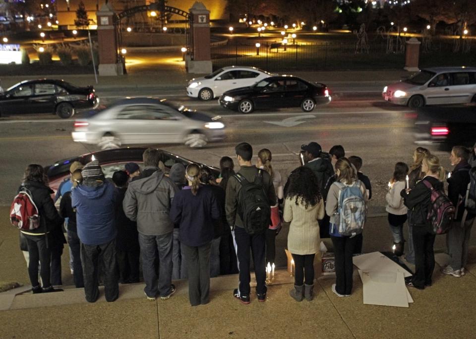 Supporters of "Missourians for Alternatives to the Death Penalty" (MADP) attend a candlelight vigil for death row inmate Joseph Franklin on the steps of St. Francis Xavier Church in St. Louis