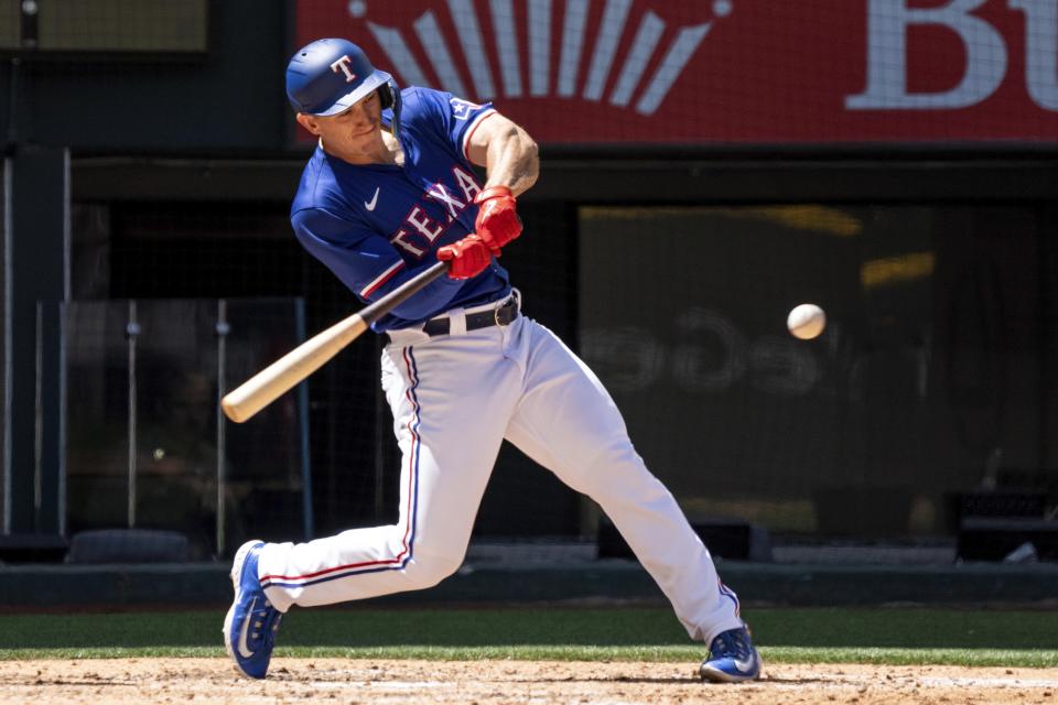 Texas Rangers' Wyatt Langford connects on a double during the fourth inning of a spring training baseball game against the Boston Red Sox Tuesday, March 26, 2024, in Arlington, Texas. Boston won 4-1. (AP Photo/Jeffrey McWhorter)