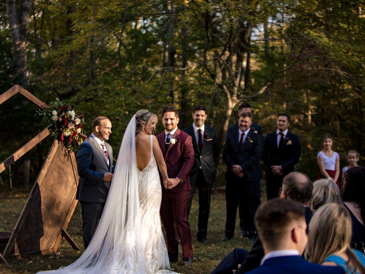 Bride and groom at the alter at campsite wedding