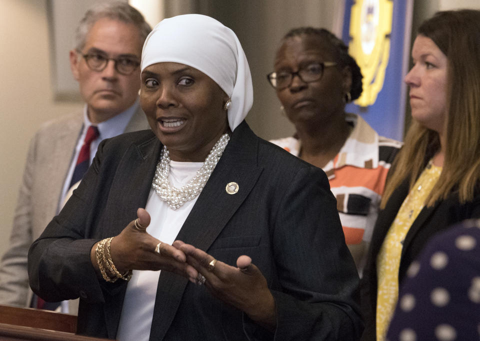 In this Aug. 1, 2018 photo, Movita Johnson Harrell, interim Supervisor Victim Witness Services, speaks at a news conference in Philadelphia. Johnson-Harrell, the first female Muslim member of the Pennsylvania House of Representatives, said Tuesday, March 26, 2019, she was offended by a colleague's decision to open a voting session with a prayer a day earlier that "at the name of Jesus every knee will bow." (Jose F. Moreno/The Philadelphia Inquirer via AP)