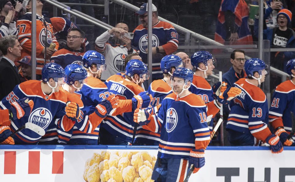 Edmonton Oilers' Zach Hyman (18) is congratulated for a goal against the St. Louis Blues during the first period of an NHL hockey game Wednesday, Feb. 28, 2024, in Edmonton, Alberta. (Jason Branson/The Canadian Press via AP)