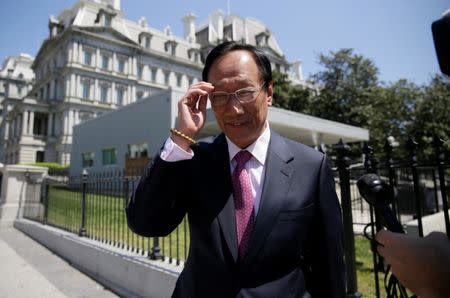 FILE PHOTO - Foxconn Chairman Terry Gou talks to reporters as he exits the White House following a second day of meetings in Washington, U.S. on April 28, 2017. REUTERS/Jim Bourg/File Photo