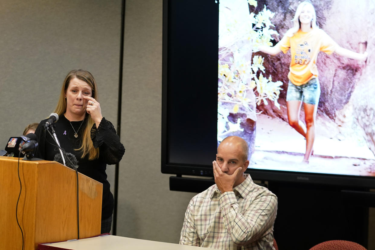 Gabby Petito's mother Nichole Schmidt, speaks during a news conference as her husband Jim Schmidt looks on Thursday, Nov. 3, 2022, in Salt Lake City. Gabby Petito's family filed a wrongful death lawsuit alleging that police failed to recognize their daughter was in a life-threatening situation last year when officers investigated a fight between her and her boyfriend. The fight happened weeks before authorities say the boyfriend killed her while the couple was on a cross-country van trip. (AP Photo/Rick Bowmer)