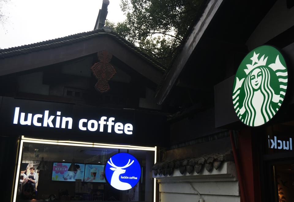 HANGZHOU, CHINA - FEBRUARY 25, 2024 - Photo taken on Feb 25, 2024 shows a nearby Luckin Coffee and Starbucks store in Hangzhou, East China's Zhejiang province. Recently, Luckin Coffee announced 2023 annual financial report, Luckin Coffee 2023 total net income of 24.903 billion yuan (about 3.46 billion US dollars), an increase of 87.3%, in the annual sales scale for the first time exceeded Starbucks China 22.739 billion yuan (3.16 billion US dollars). Thus becoming the largest coffee chain in the Chinese market. (Photo credit should read CFOTO/Future Publishing via Getty Images)