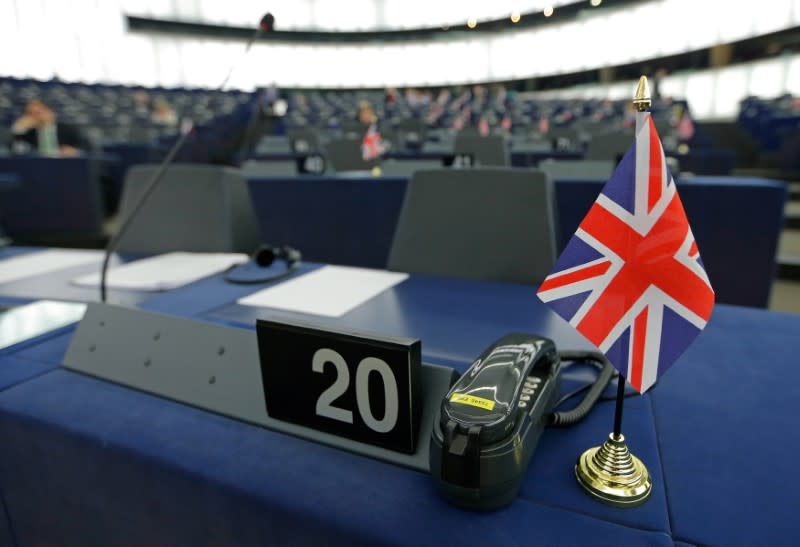 FILE PHOTO: A British Union Jack flag is seen on the desk of Farage, leader of the UKIP and MEP, ahead of a debate at the European Parliament in Strasbourg