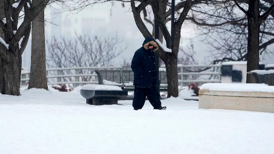 PHOTO: A person walks through snow on Jan. 18, 2024, in Nashville, Tenn.  (George Walker IV/AP)