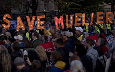 Demonstrators calling to protect Robert Mueller, the special counsel, after the firing of Jeff Sessions as attorney general - Credit: Andrew Harrer/Bloomberg