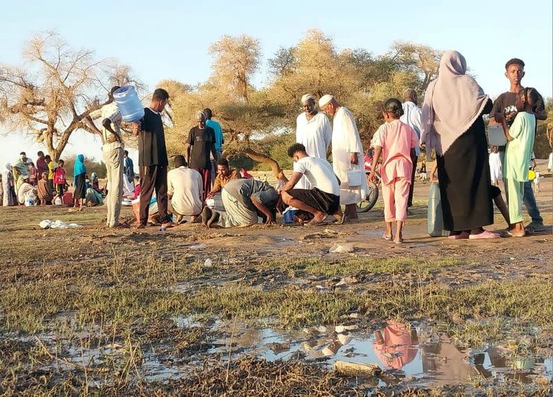 Citizens digging small holes at the shore to get pure water at the banks of the White Nile in Khartoum