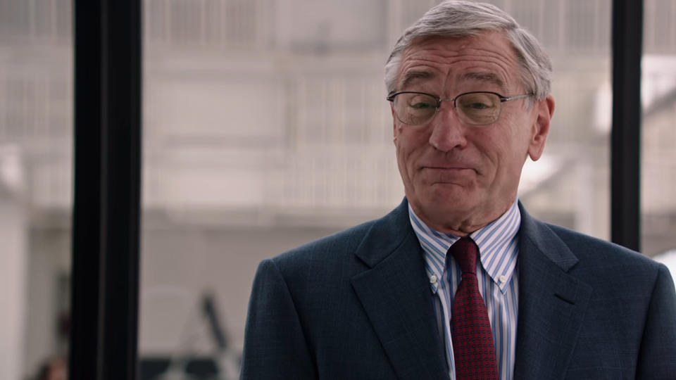 Robert De  Niro wearing glasses and a suit in The Intern