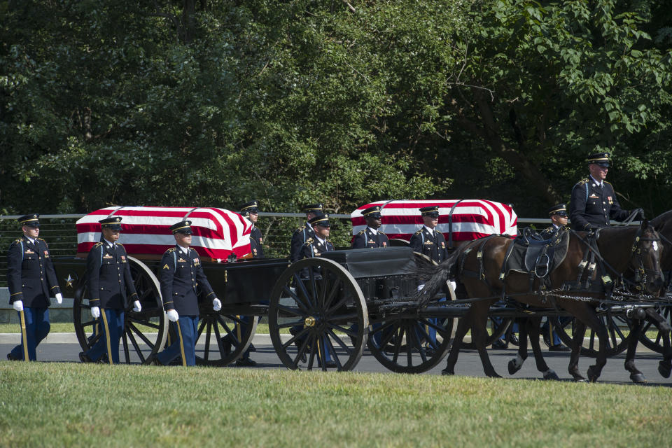 Soldiers from the 3rd Infantry Regiment, also known as the Old Guard, carry the remains of two unknown Civil War Union soldiers on horse-drawn caissons to their grave at Arlington National Cemetery in Arlington, Va., Thursday, Sept. 6, 2018. The soldiers were discovered at Manassas National Battlefield and will be buried in Section 81. Arlington National Cemetery opened the new section of gravesites with the burial. (AP Photo/Cliff Owen)