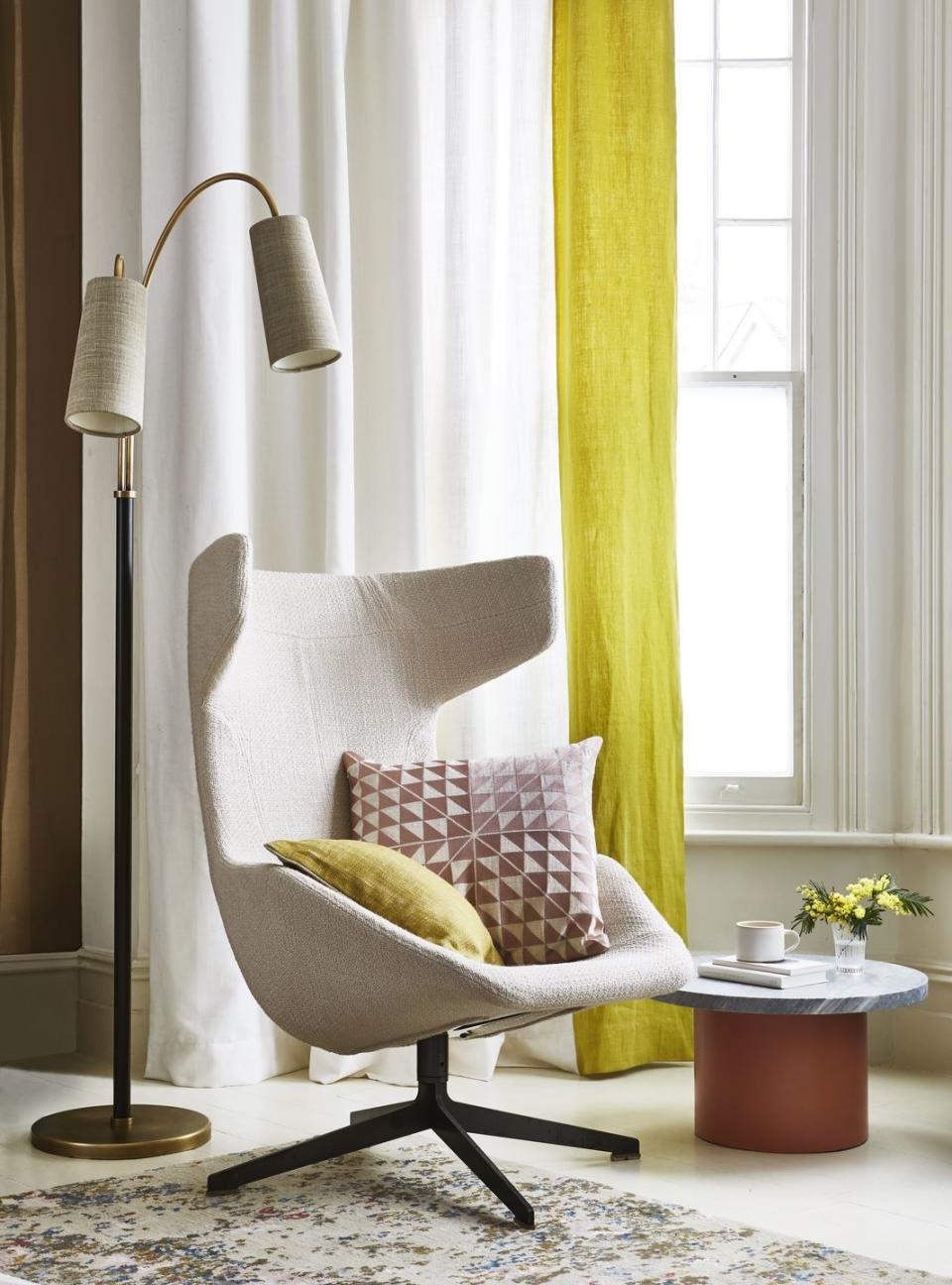 yellow curtain hanging in the window