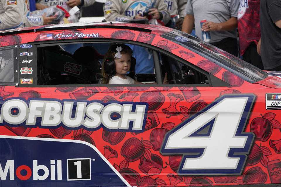 Kevin Harvick's daughter Piper rides in his car after winning the NASCAR Cup Series auto race at the Michigan International Speedway in Brooklyn, Mich., Sunday, Aug. 7, 2022. (AP Photo/Paul Sancya)