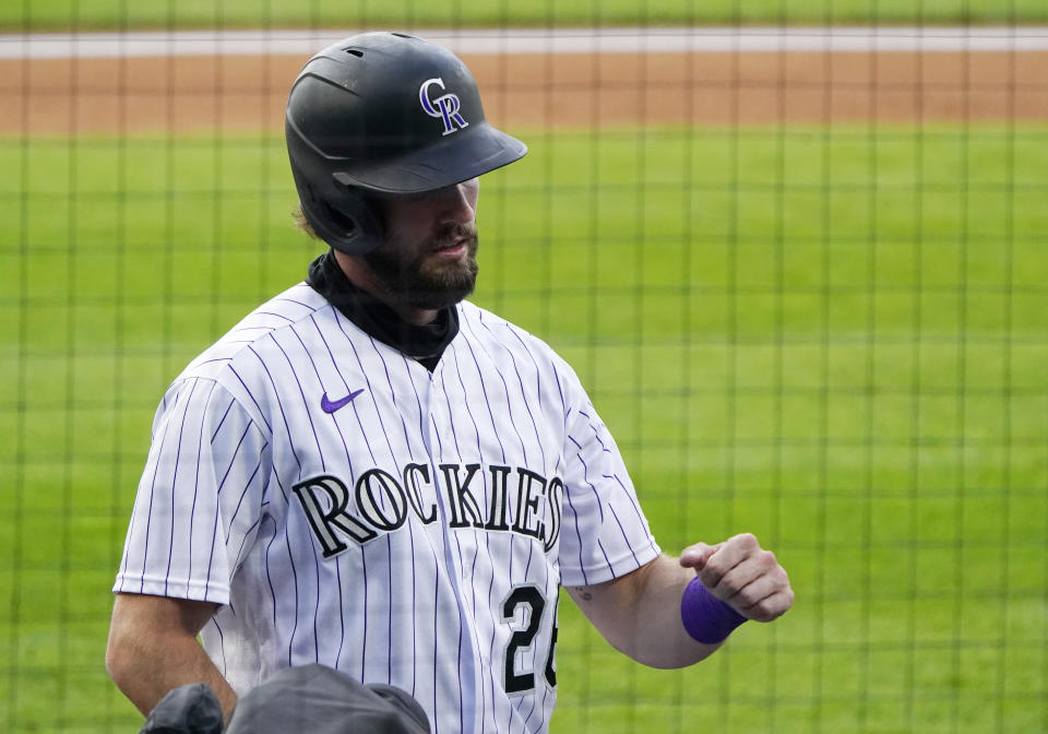 Colorado Rockies left fielder David Dahl (26) celebrates a run scored against the San Francisco Giants during the first inning of a baseball game, Tuesday, Aug. 4, 2020, in Denver. (AP Photo/Jack Dempsey)