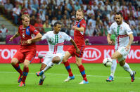 WARSAW, POLAND - JUNE 21: Nani of Portugal is held by David Limbersky of Czech Republic during the UEFA EURO 2012 quarter final match between Czech Republic and Portugal at The National Stadium on June 21, 2012 in Warsaw, Poland. (Photo by Shaun Botterill/Getty Images)