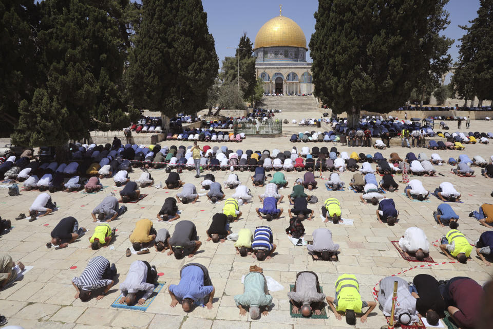 Palestinians pray in the Al Aqsa Mosque compound in Jerusalem's old city, Friday, Aug. 14, 2020. (AP Photo/Mahmoud Illean)