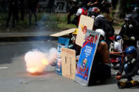 Demonstrators use home-made mortars while clashing with riot security forces during a rally against President Nicolas Maduro in Caracas, Venezuela May 24, 2017. REUTERS/Carlos Garcia Rawlins