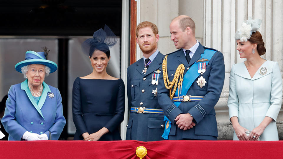 The queen with Meghan, Duchess of Sussex, Prince Harry, Duke of Sussex, Prince William, Duke of Cambridge, and Catherine, Duchess of Cambridge, watching a flypast to mark the centenary of the Royal Air Force from the balcony of Buckingham Palace on July 10, 2018. - Credit: Max Mumby/Indigo