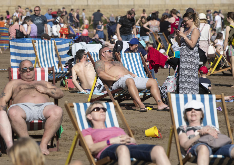 People enjoy the hot weather on Scarborough beach as Britain is set for a sunny Easter bank holiday weekend, that could break national records.