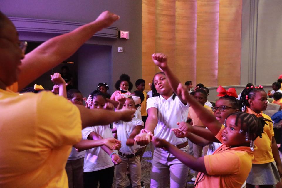 Students from Andrea B. Williams Elementary sing and dance to "Baby Shark" before the start of the Savannah Music Festival Musical Explorers concert at the Trustees Theater.