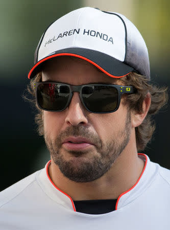 McLaren's Fernando Alonso of Spain enters the Marina Bay Circuit ahead of the Singapore F1 Grand Prix Night Race in Singapore, September 15, 2016. REUTERS/Jeremy Lee