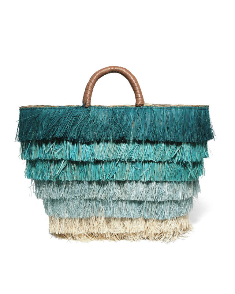 <p>Blue fringed trim straw bag, <a rel="nofollow noopener" href="https://www.net-a-porter.com/gb/en/product/899294/Kayu/pinata-leather-trimmed-fringed-straw-tote" target="_blank" data-ylk="slk:£115;elm:context_link;itc:0;sec:content-canvas" class="link ">£115</a></p>