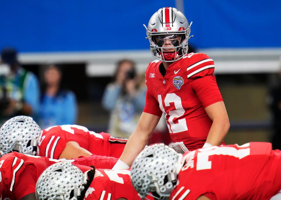 Dec 29, 2023; Arlington, Texas, USA; Ohio State Buckeyes quarterback Lincoln Kienholz (12) replaced injured starting quarterback Devin Brown (33) in the second quarter against Missouri Tigers during the Goodyear Cotton Bowl Classic at AT&T Stadium.