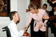 1989: The Princess helps break the stigma surrounding Aids and HIV when she shakes hands with a terminally ill patient and kisses him on the cheek at an east London hospice.