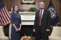 Judge Amy Coney Barrett, President Donald Trump's nominee to the Supreme Court, meets with Sen. Mike Crapo, R-Idaho, at the Capitol, Tuesday, Sept. 29, 2020 in Washington. (Tasos Katopodis/Pool via AP)