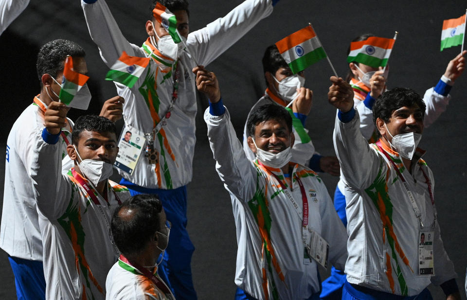 Athletes from  India's delegation wave their national flag as they parade during the closing ceremony of the Tokyo 2020 Olympic Games, on August 8, 2021 at the Olympic Stadium in Tokyo. (Photo by Oli SCARFF / AFP) (Photo by OLI SCARFF/AFP via Getty Images)