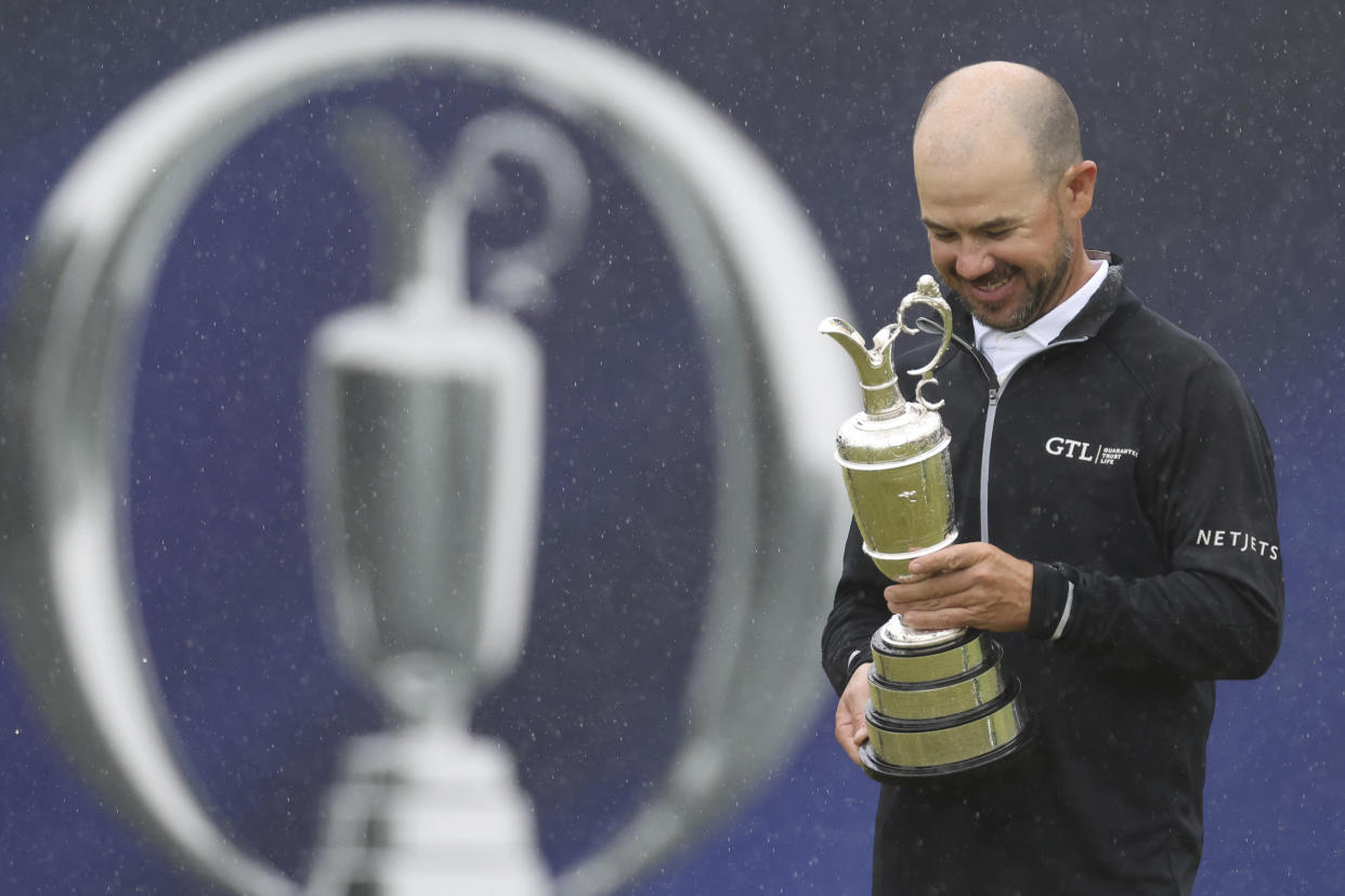 United States&#39; Brian Harman poses for the media as he holds the Claret Jug trophy for winning the British Open Golf Championships at the Royal Liverpool Golf Club in Hoylake, England, Sunday, July 23, 2023. (AP Photo/Peter Morrison)