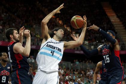 Argentina's Luis Scola, center, battles Team USA forwards Kevin Love, left, and Carmelo Anthony for a rebound. (Reuters)