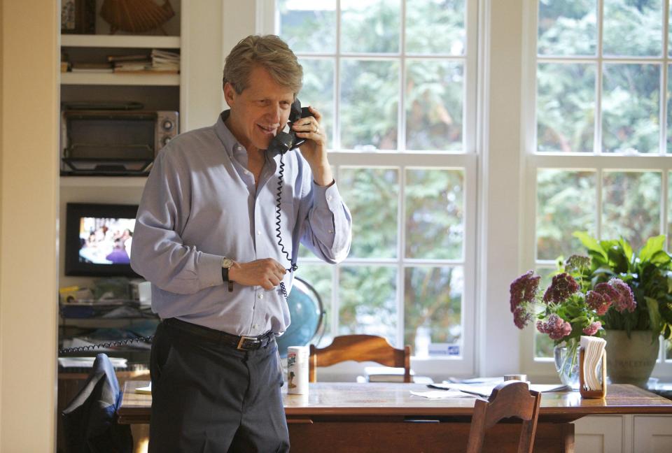 Robert Shiller, one of three American scientists who won the 2013 economics Nobel prize, speaks on the phone in New Haven