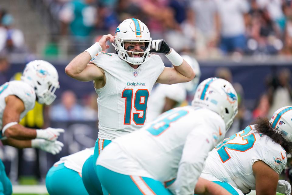 Miami Dolphins quarterback Skylar Thompson talks to his teammates before running a play against the Houston Texans during the second half of an NFL preseason football game, Saturday, Aug. 19, 2023, in Houston. (AP Photo/Eric Christian Smith)