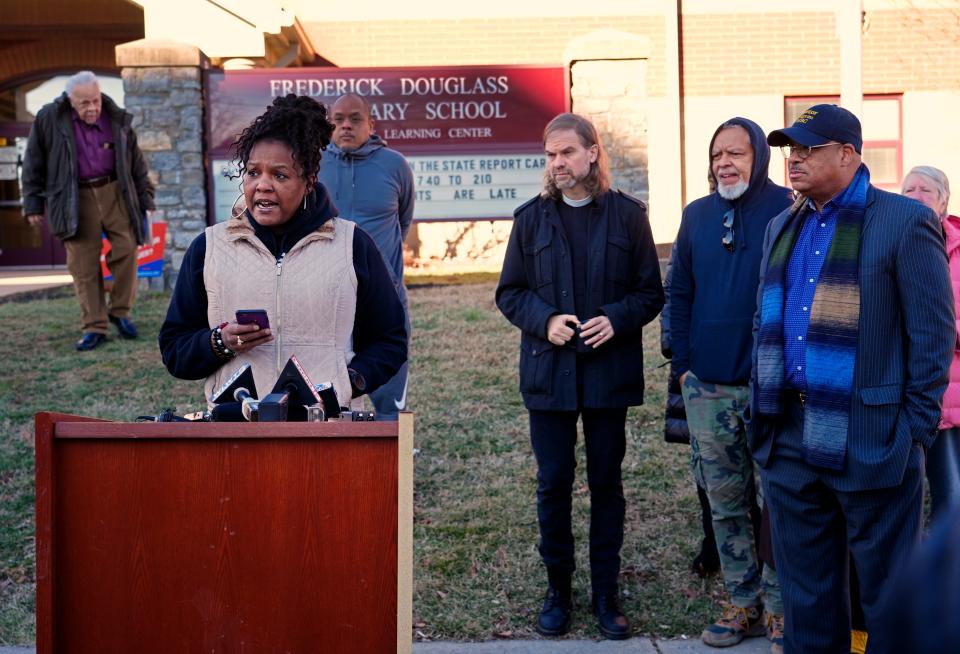 Mona Jenkins, Walnut Hills area council president, speaks during a MOnday press conference in front of Frederick Douglass Elementary.  The Cincinnati Public Schools Board of Education is discussing the possibility of closing the elementary school and merging it with Evanston. Jenkins said they were never brought into the process and are against the merger.