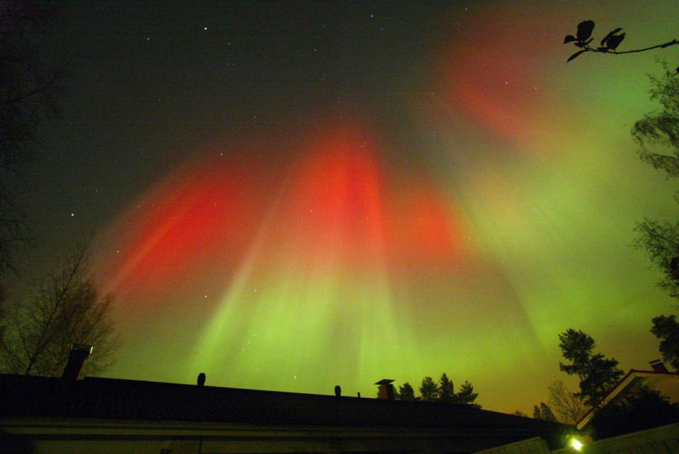 The aurora borealis is seen over the town of Hyvinkaa in southern Finland October 31, 2003. The aurora is very visible at the moment as a result of a second huge magnetic solar storm hitting the Earth on Thursday. REUTERS/ LEHTIKUVA / Pekka Sakki <br> <br> <a href="http://bitly.com/ziMhy4" rel="nofollow noopener" target="_blank" data-ylk="slk:See more photos of the Northern Lights on Flickr;elm:context_link;itc:0;sec:content-canvas" class="link ">See more photos of the Northern Lights on Flickr</a>