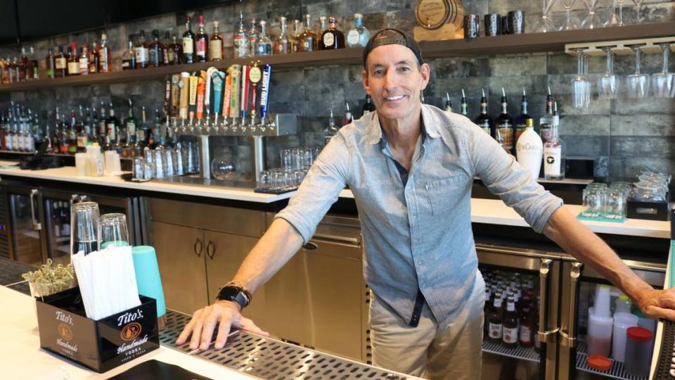 Russell Matthes, who is co-owner with Tom Halkidis of the recently opened The Greyson at 5045 96th St. E., Palmetto, stands at the bar 5/7/2023. The Greyson is a family-friendly restaurant and sports bar.