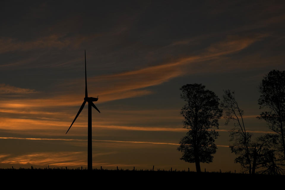 An electricity windmills stands next to an underground laboratory run by French radioactive waste management agency Andra, in Bure, eastern France, Thursday, Oct. 28, 2021. The laboratory, at around 500 meters below the surface, is designed to prepare for a proposed long-term deep-earth nuclear waste repository. (AP Photo/Francois Mori)