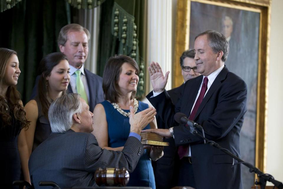 New Texas Attorney General Ken Paxton takes the oath of office in the Senate Chamber on Jan. 5, 2015.