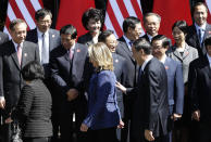 BEIJING, CHINA - MAY 3: U.S. Secretary of State Hillary Clinton (front row 2nd L) and China's Vice Premier Wang Qishan (R) arrive at a group photo shooting after the opening ceremony of U.S.-China Strategic and Economic Dialogue at Diaoyutai State Guesthouse on May 3, 2012 in Beijing, China. High-level representatives from both countries will meet to discuss a wide range of issues from economics to security. (Photo by Jason Lee-Pool/Getty Images)