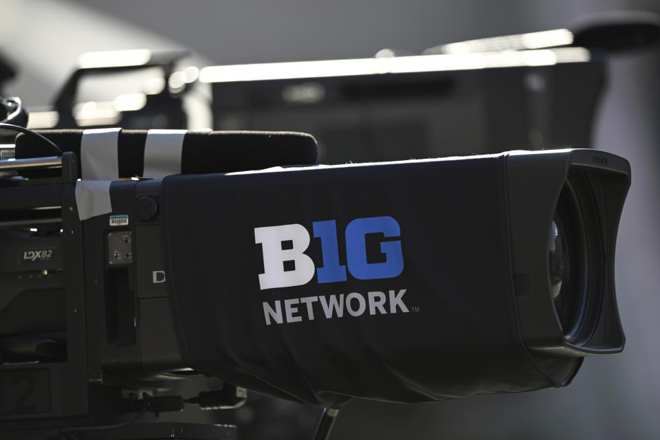 FILE - A network television camera is photographed before an NCAA college football game Oct. 22, 2022, in College Park, Md. The NCAA and the nation's five biggest conferences have agreed to pay nearly $2.8 billion to settle a host of antitrust claims,a monumental decision that sets the stage for a groundbreaking revenue-sharing model that could start directing millions of dollars directly to athletes as soon as the 2025 fall semester. (AP Photo/Gail Burton, File)