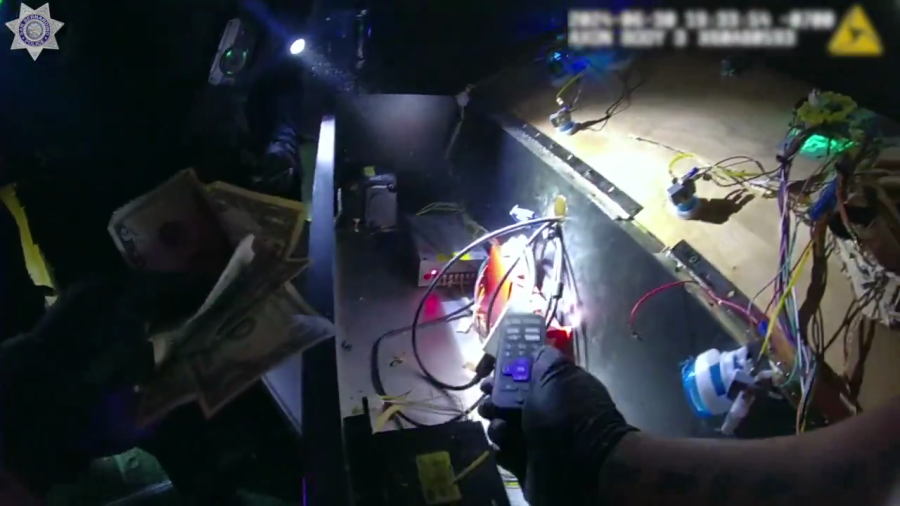 Video shared by the San Bernardino Police Department on social media shows officers discovering cash hidden in an illegal gaming device after responding to a call. It’s unclear when and where the bust happened.