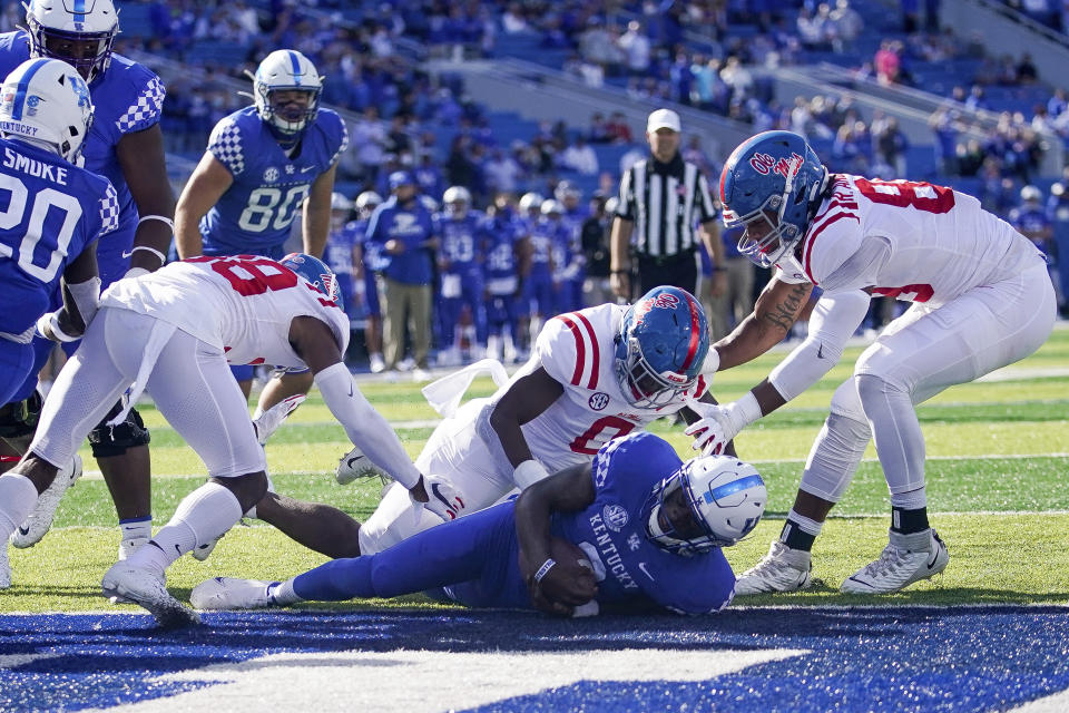 Kentucky quarterback Terry Wilson (3) scores a touchdown during the first half of an NCAA college football game against Mississippi, Saturday, Oct. 3, 2020, in Lexington, Ky. (AP Photo/Bryan Woolston)