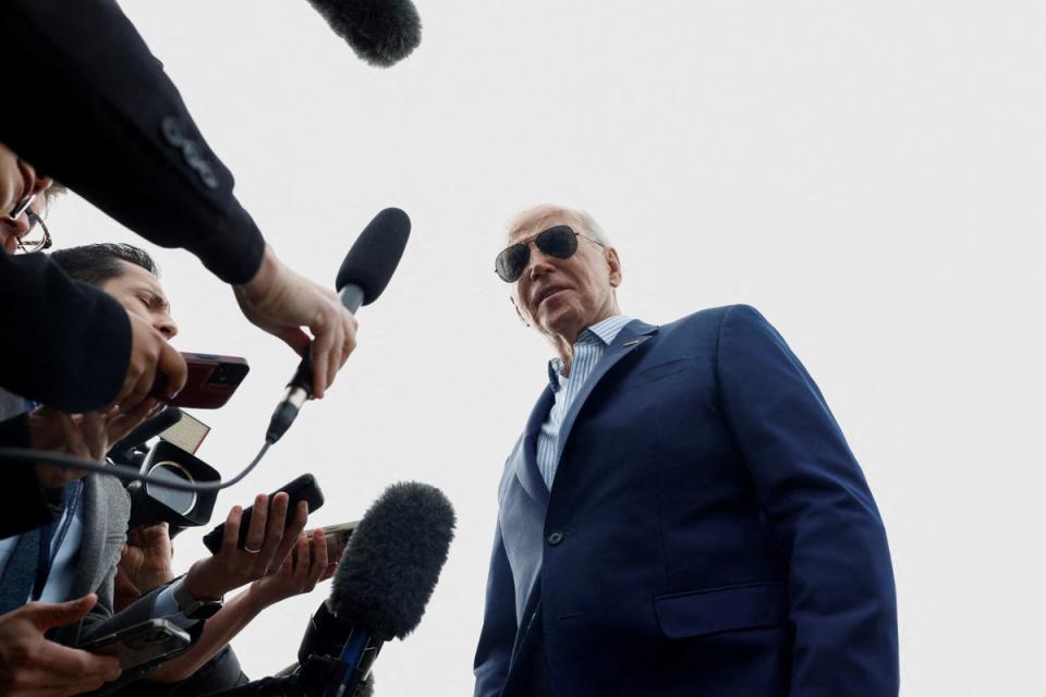 President Joe Biden speaks to reporters on 8 March (Reuters)