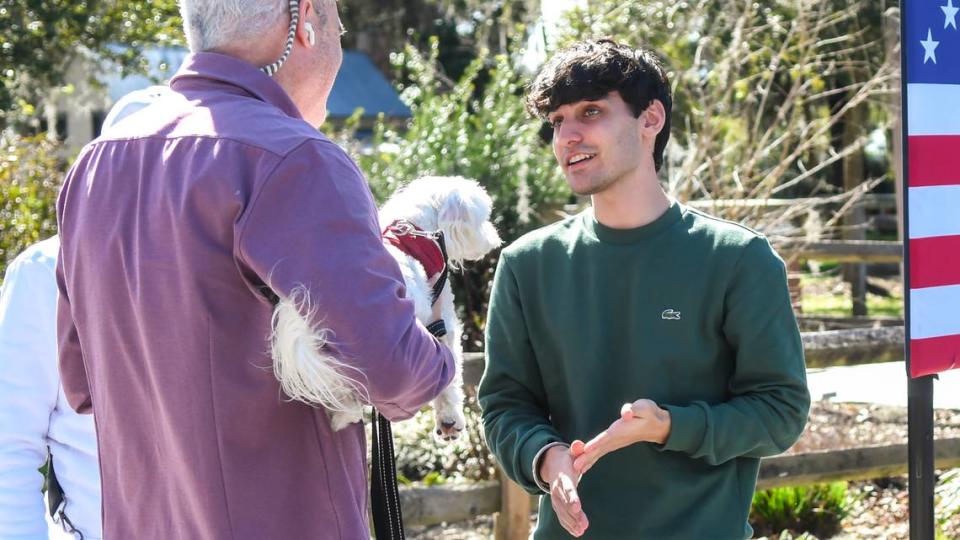 Nalin Haley, son of former S.C. Gov. and U.S. Ambassador to the United Nations Nikki Haley, talks to a constituent on Tuesday, Feb. 13, 2024 at Bluffton Oyster Factory Park in Old Town Bluffton. While Nalin Haley has become more vocal in his mother’s presidential campaign, he remained in the background as local politicians voiced their support of the former governor at the local political bus tour stop.