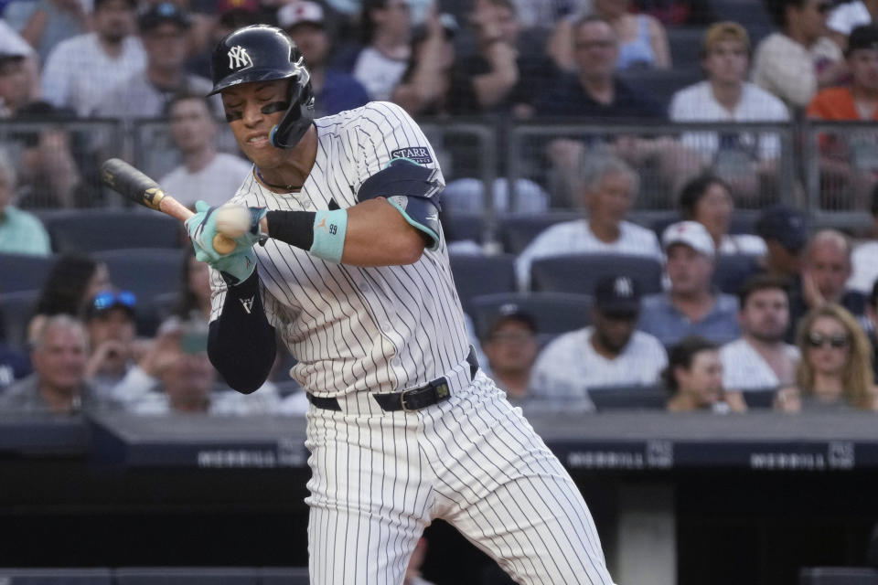 New York Yankees' Aaron Judge reacts to getting hit by a pitch from Baltimore Orioles' Albert Suárez during the third inning of a baseball game Tuesday, June 18, 2024, in New York. (AP Photo/Pamela Smith)