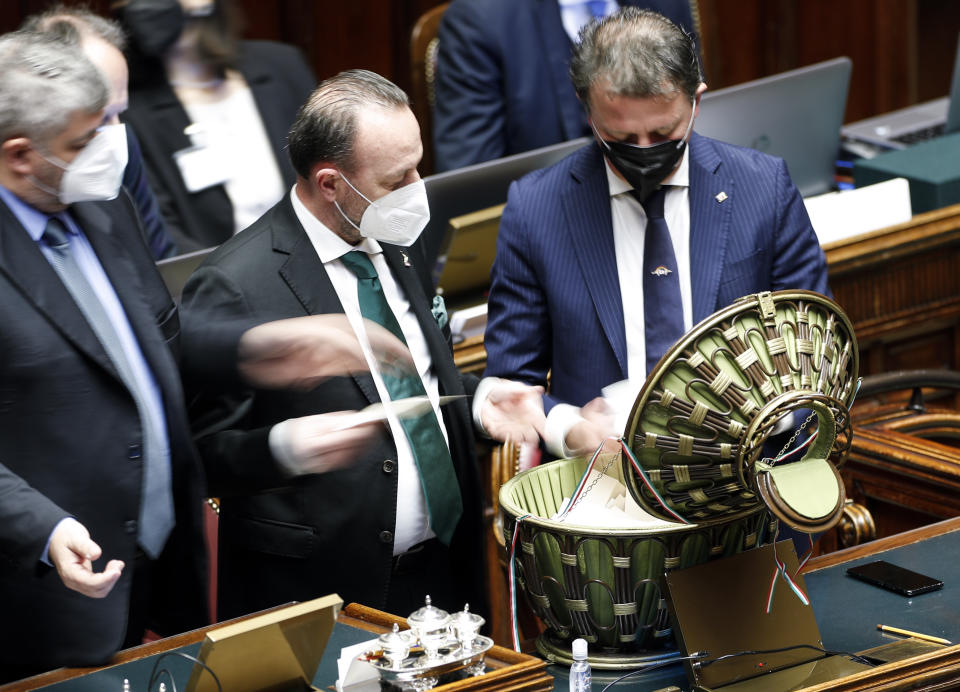 Ballots are counted in the Italian parliament in Rome, Thursday, Jan. 27, 2022. The first rounds of voting in Italy's Parliament for the country's next president yielded an avalanche of blank ballots, as lawmakers and special regional electors failed to deliver a winner amid a political stalemate. (Remo Casilli/Pool photo via AP)