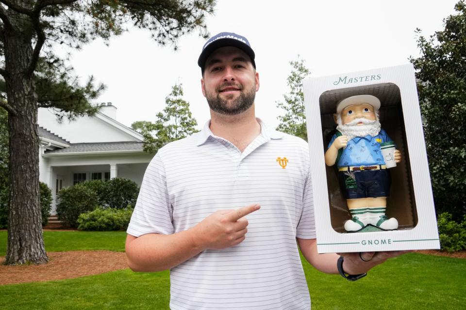 Apr 4, 2023; Augusta, Georgia, USA; Mark Pierce of Nashville, Tenn., shows off his gnome from the golf shop during a practice round for The Masters golf tournament at Augusta National Golf Club. Mandatory Credit: Rob Schumacher-USA TODAY Network